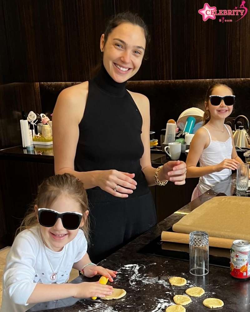 Gal Gadot, smiling, poses with her two daughters, Alma and Maya Varsano.